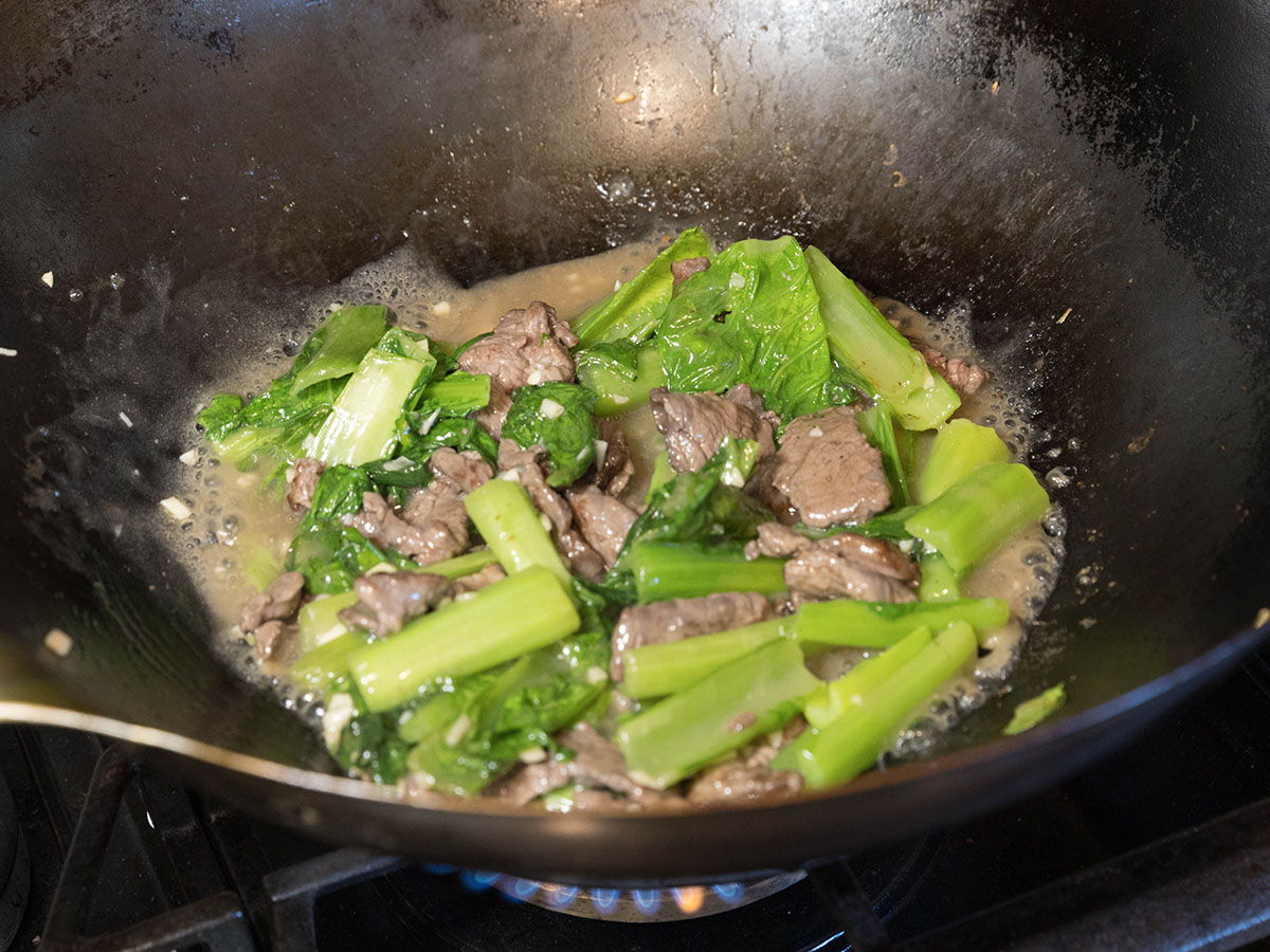 Simmering beef and greens.